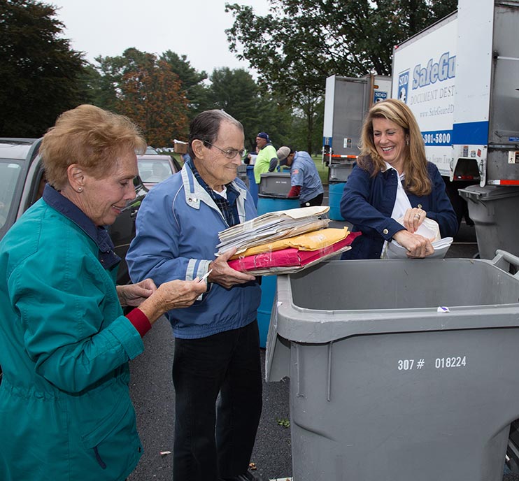 Freeholder Serena DiMaso, Esq. (far right) pitched-in to help residents dispose of documets properly at a 2016 paper shredding event. 
